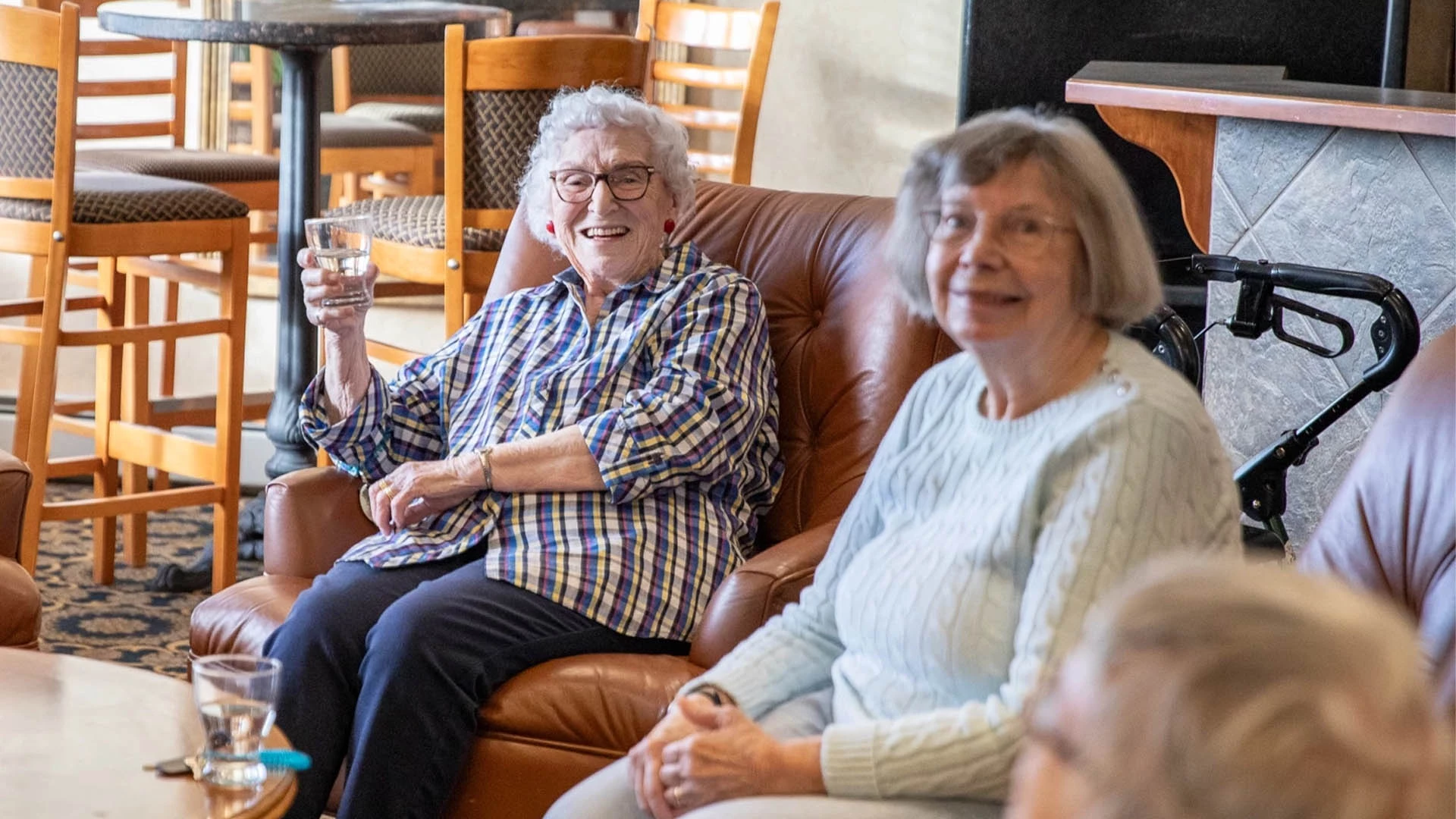 A group of older women sitting in a lounge.