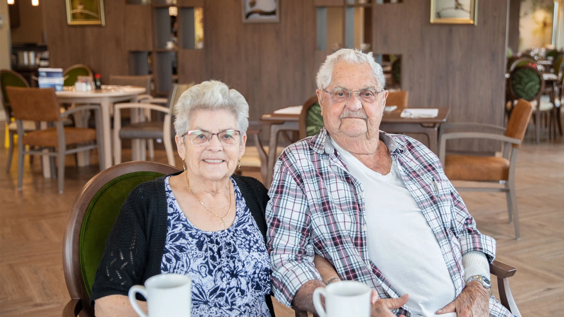 seniors couple smiling at the camera